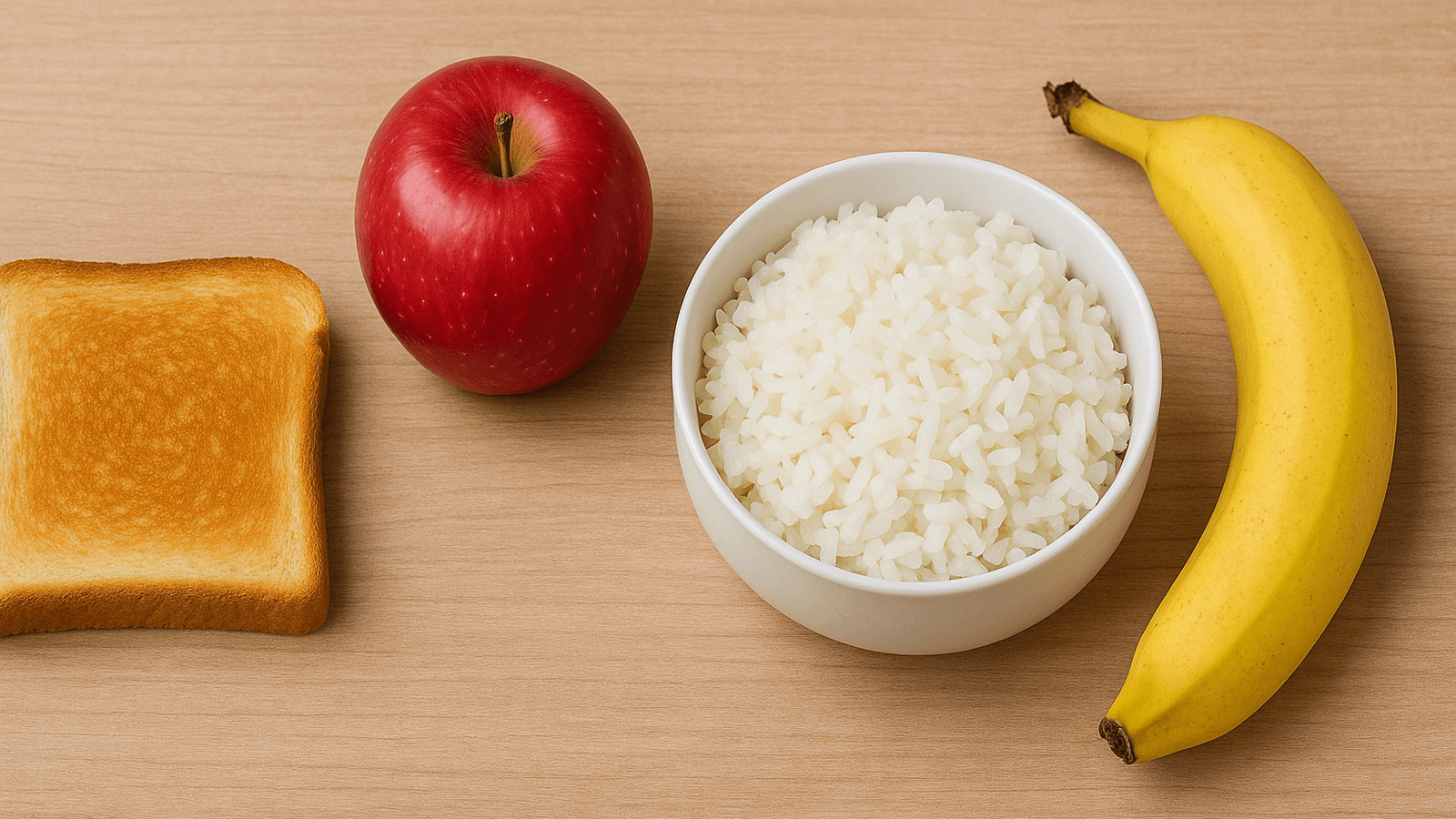 تصویر رژیم غذایی سبک شامل برنج پخته، سیبزمینی آبپز، موز و نان تست برای سلامت روده.